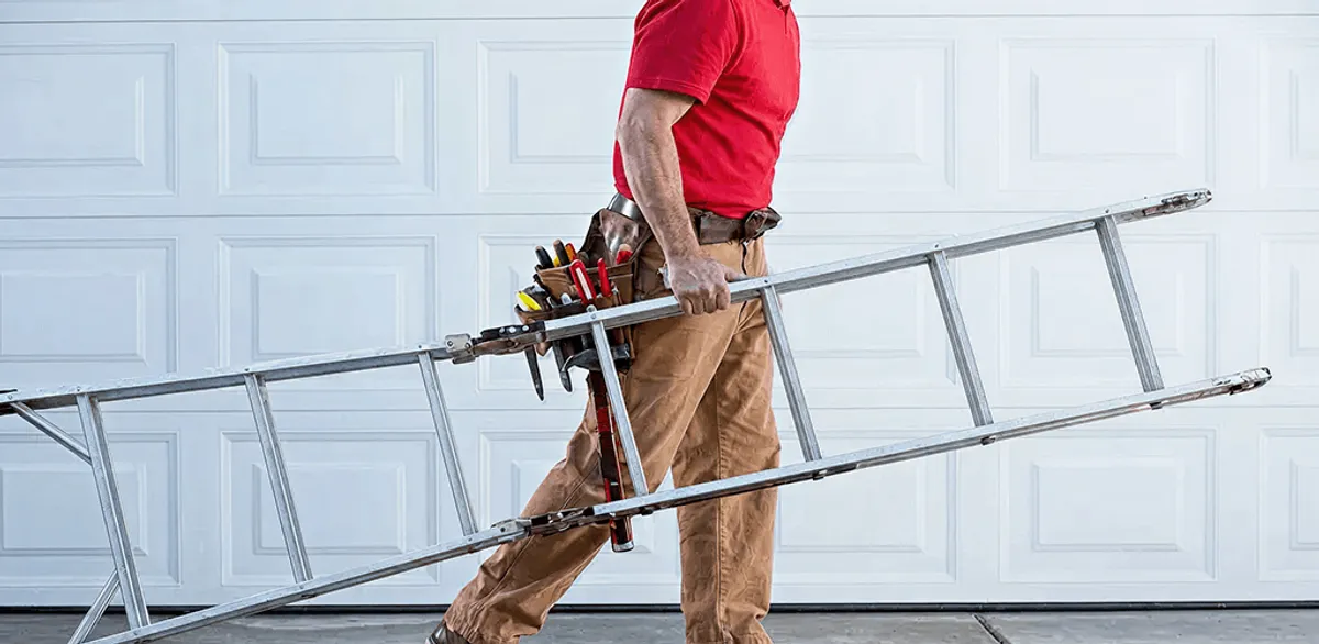 Garage door repair technician arriving with tools and ladder in Fort Lauderdale, FL