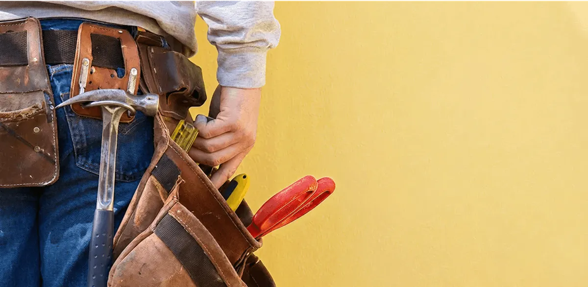 Handyman with tool belt ready for home repairs and maintenance in Fort Lauderdale, FL